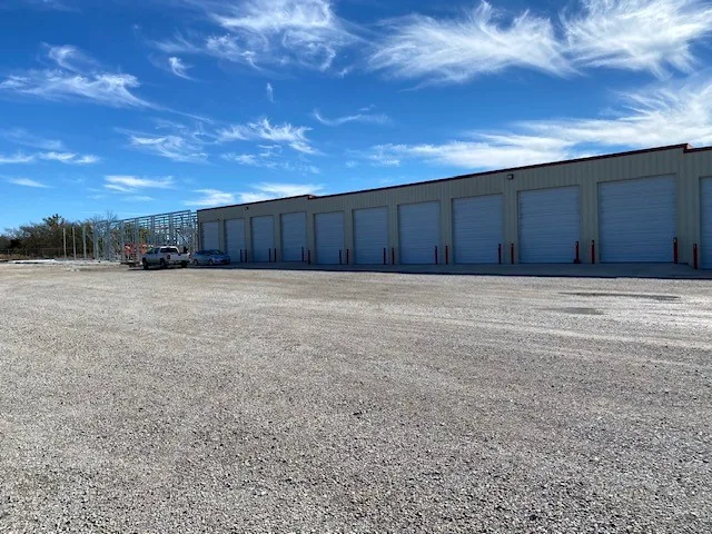 The storage building and lot under a blue sky in Glenpool